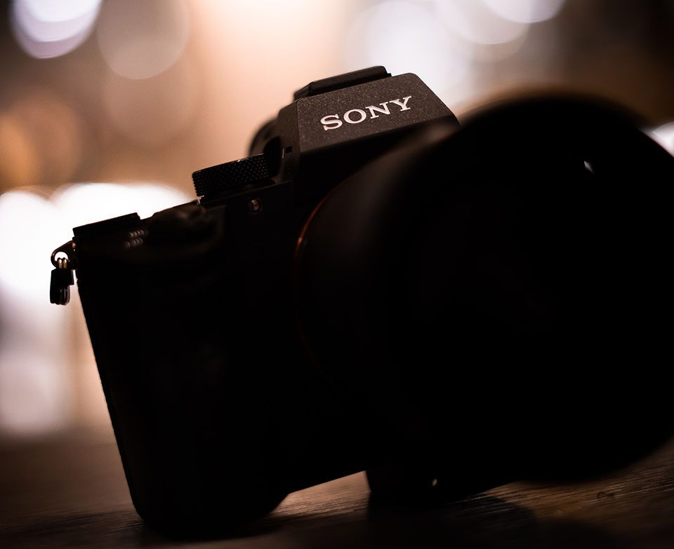 a camera and a lens with bokeh background
